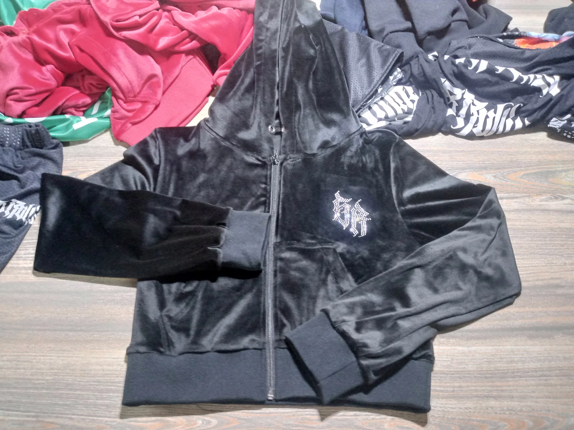 Black velour zip hoodie with rhinestone logo
