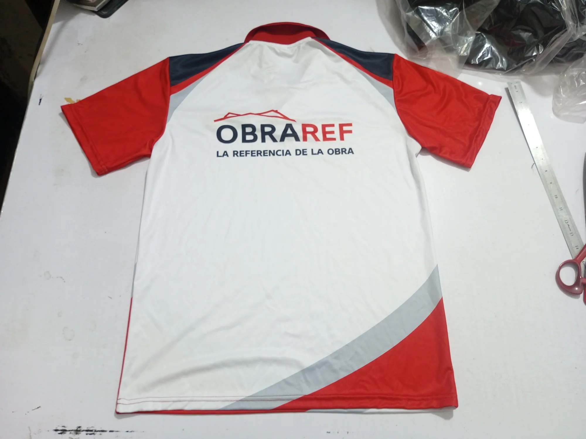 Custom sublimated polo shirt back with large logo print