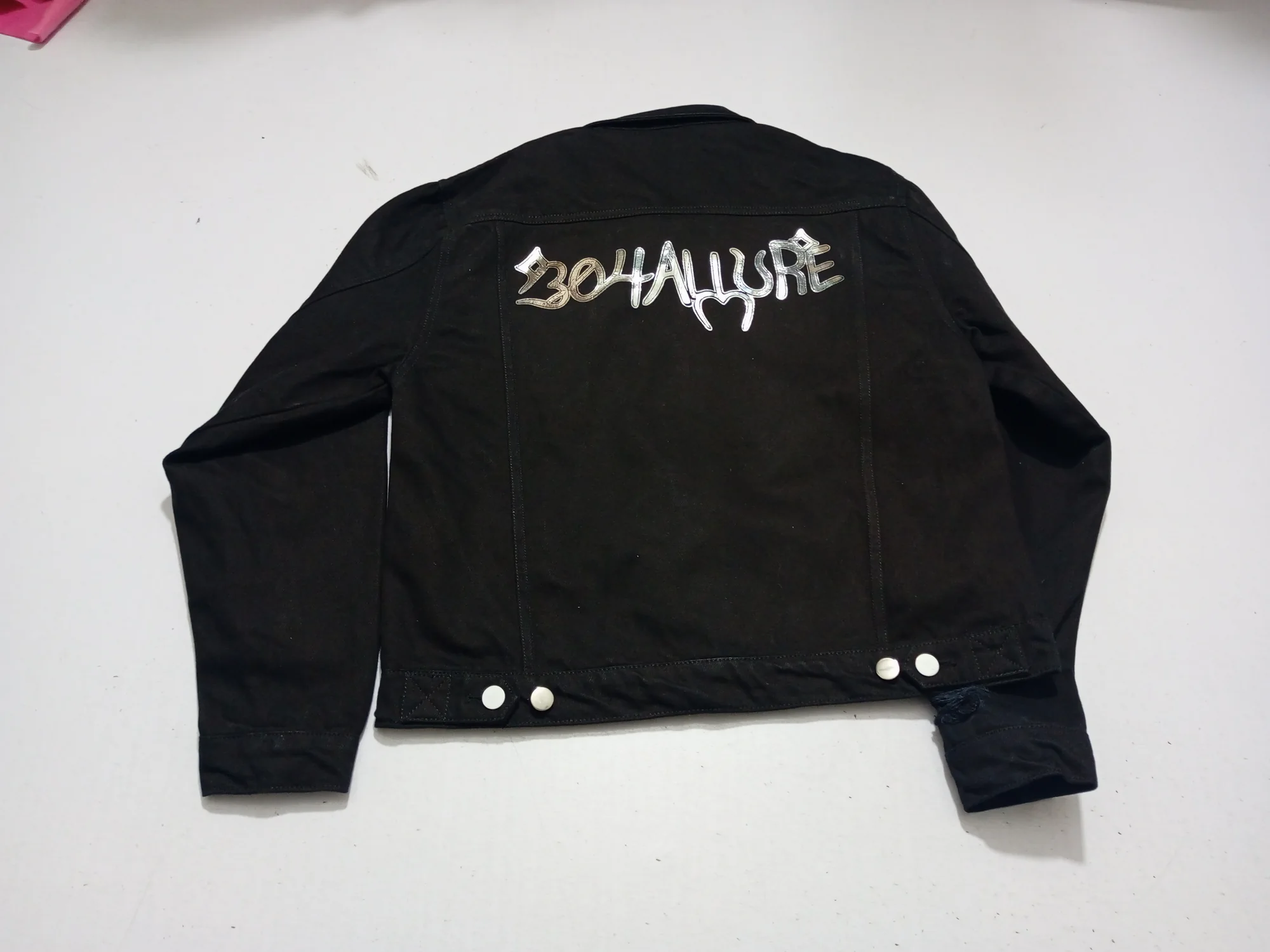 Denim jacket back with metallic foil print