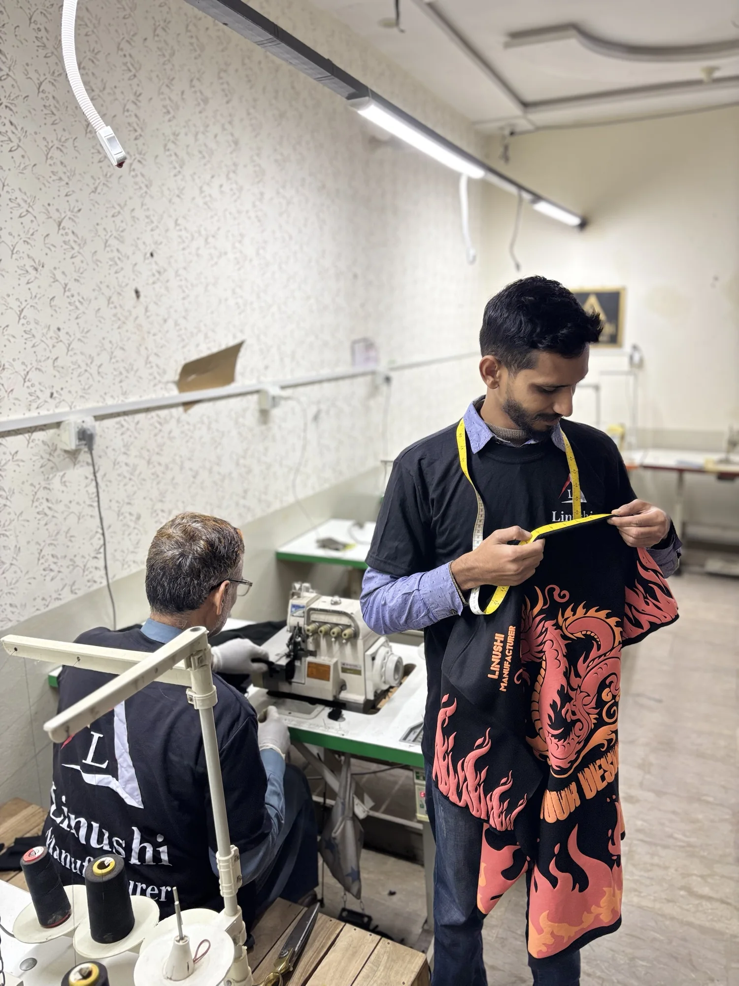 Measuring a custom printed garment during quality check