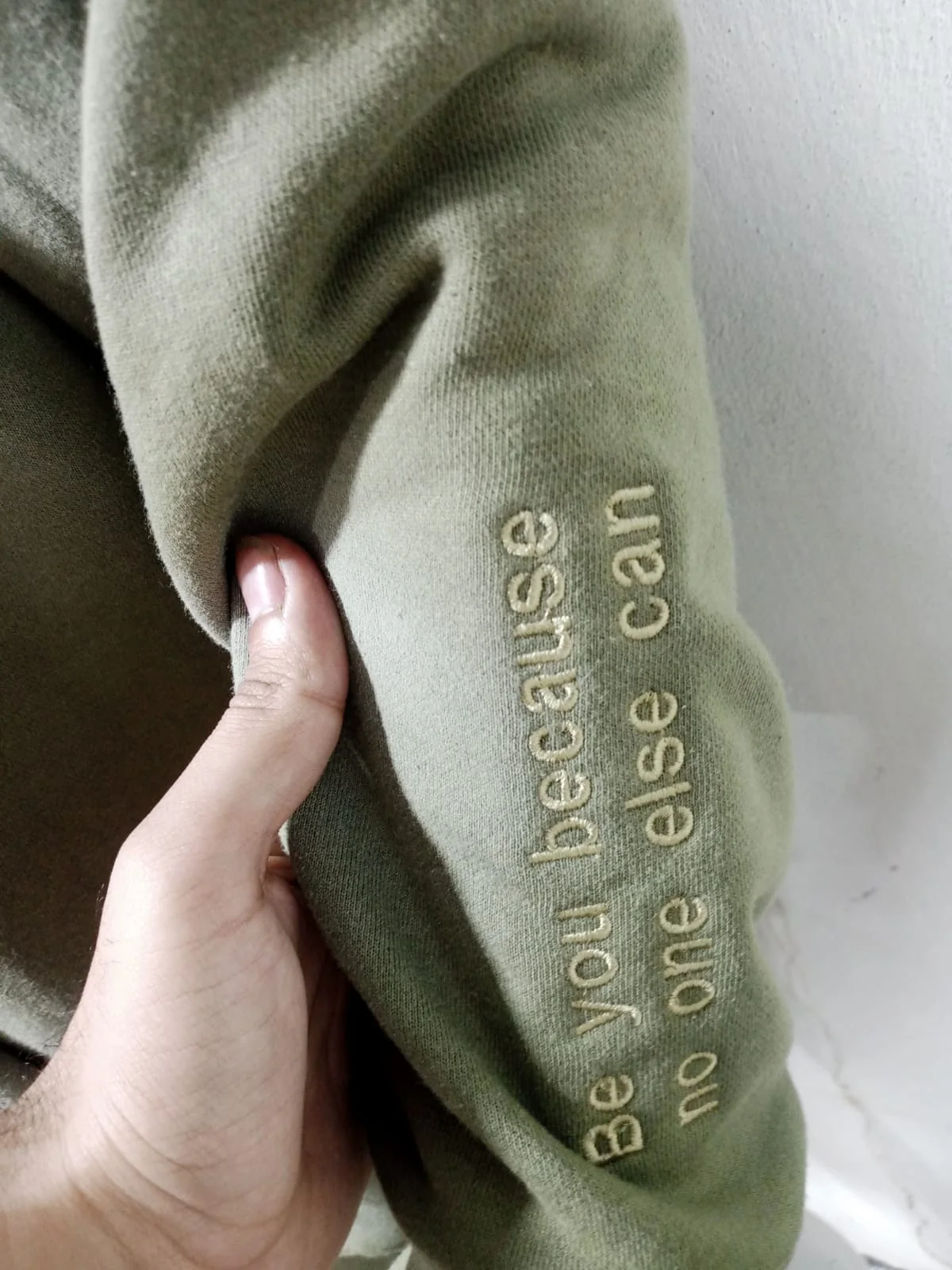 Tonal embroidery on the sleeve