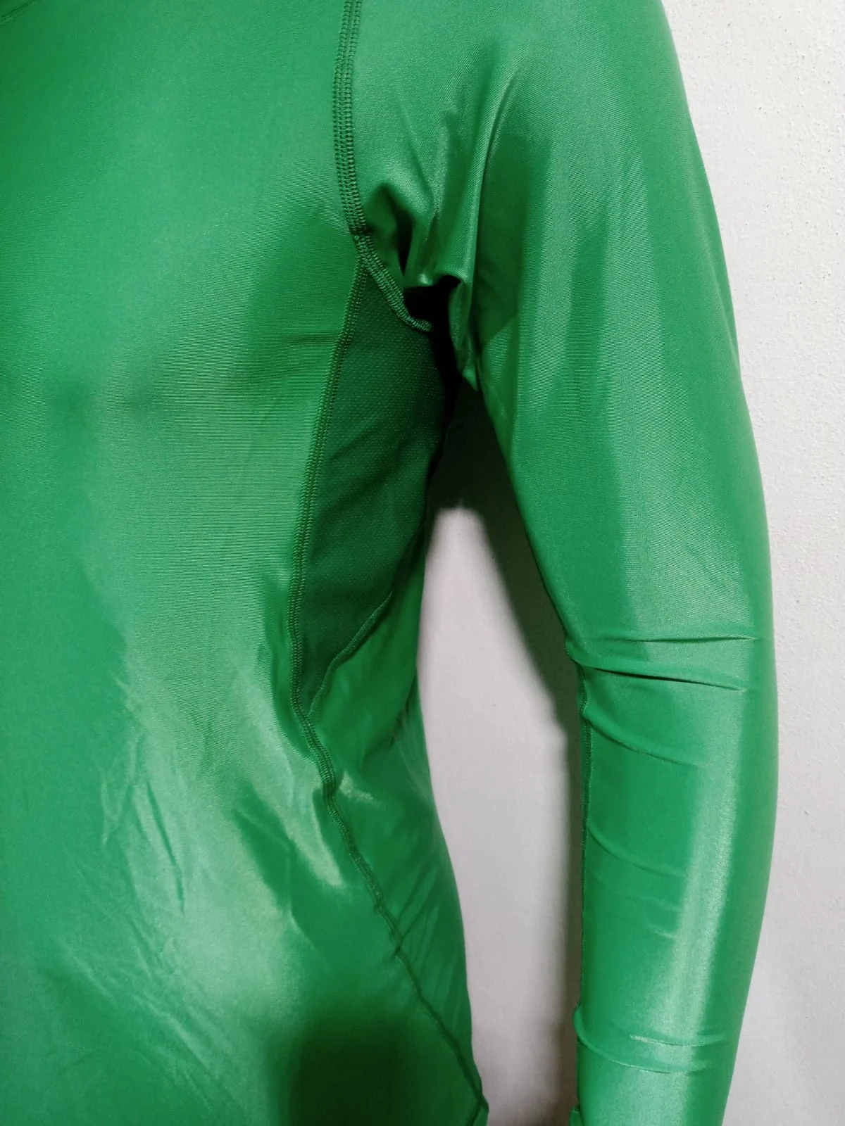 Rash guard side view showing the compression fit