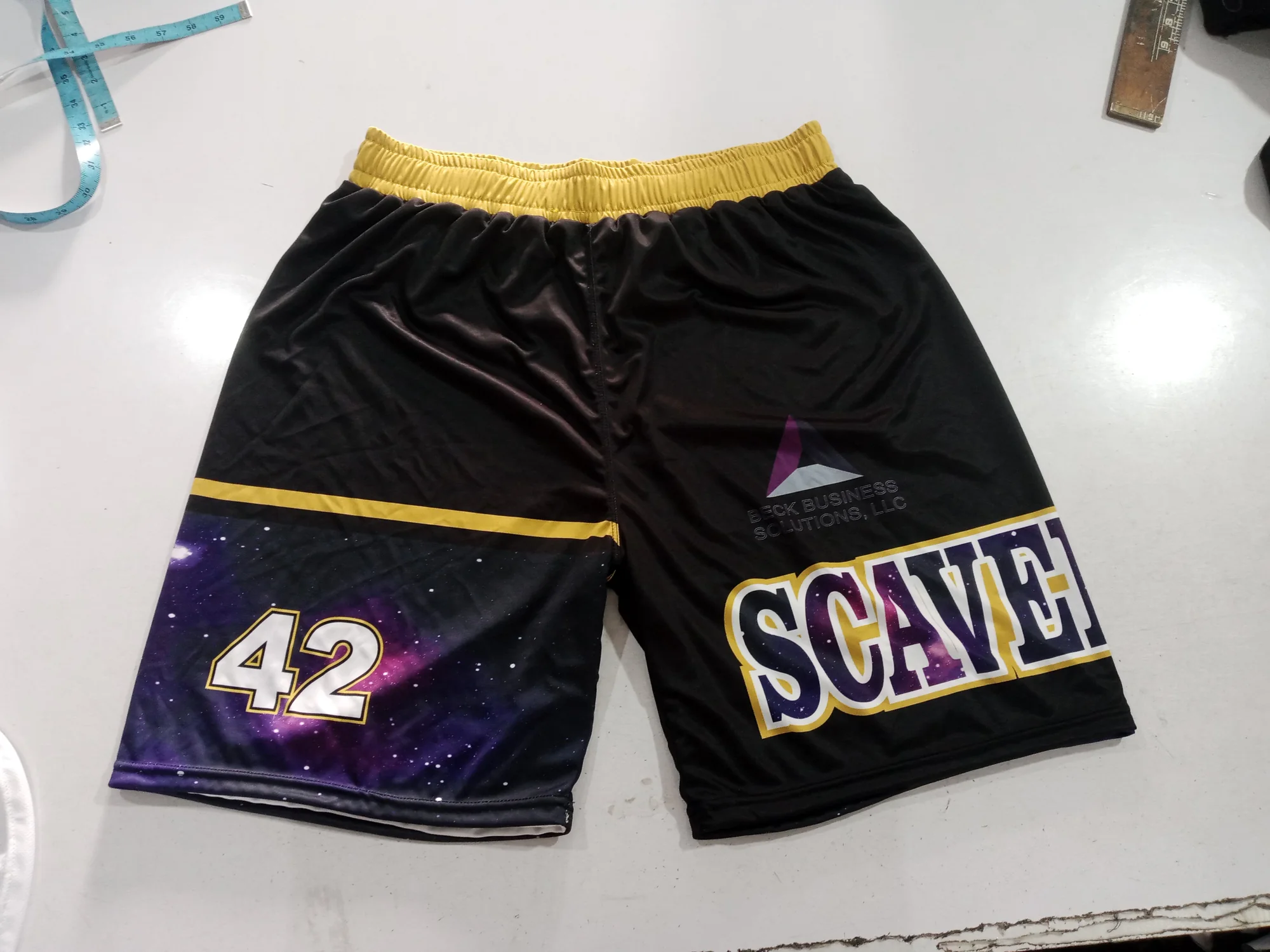 Sublimated basketball shorts, black side