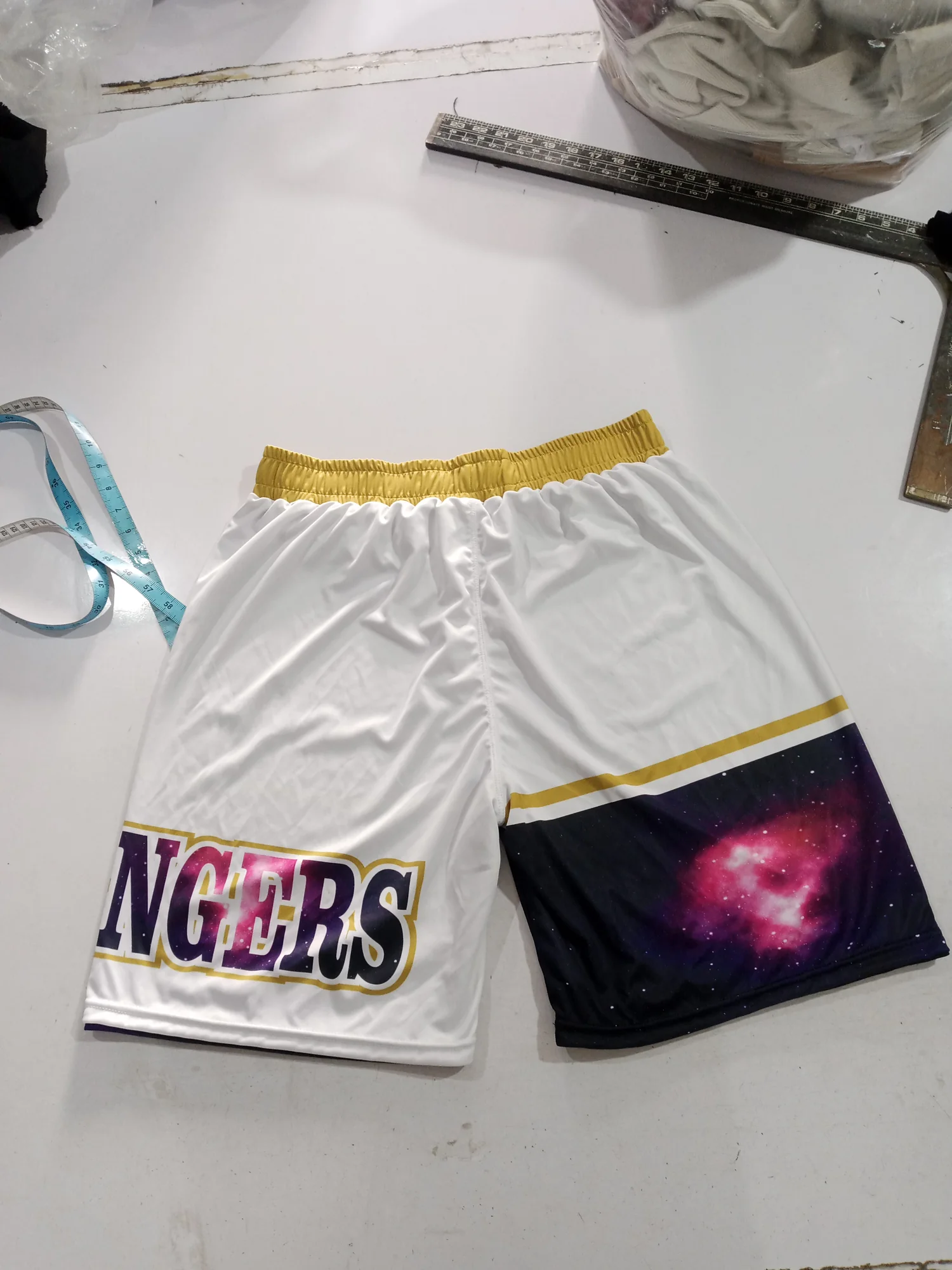 Sublimated basketball shorts, white side back