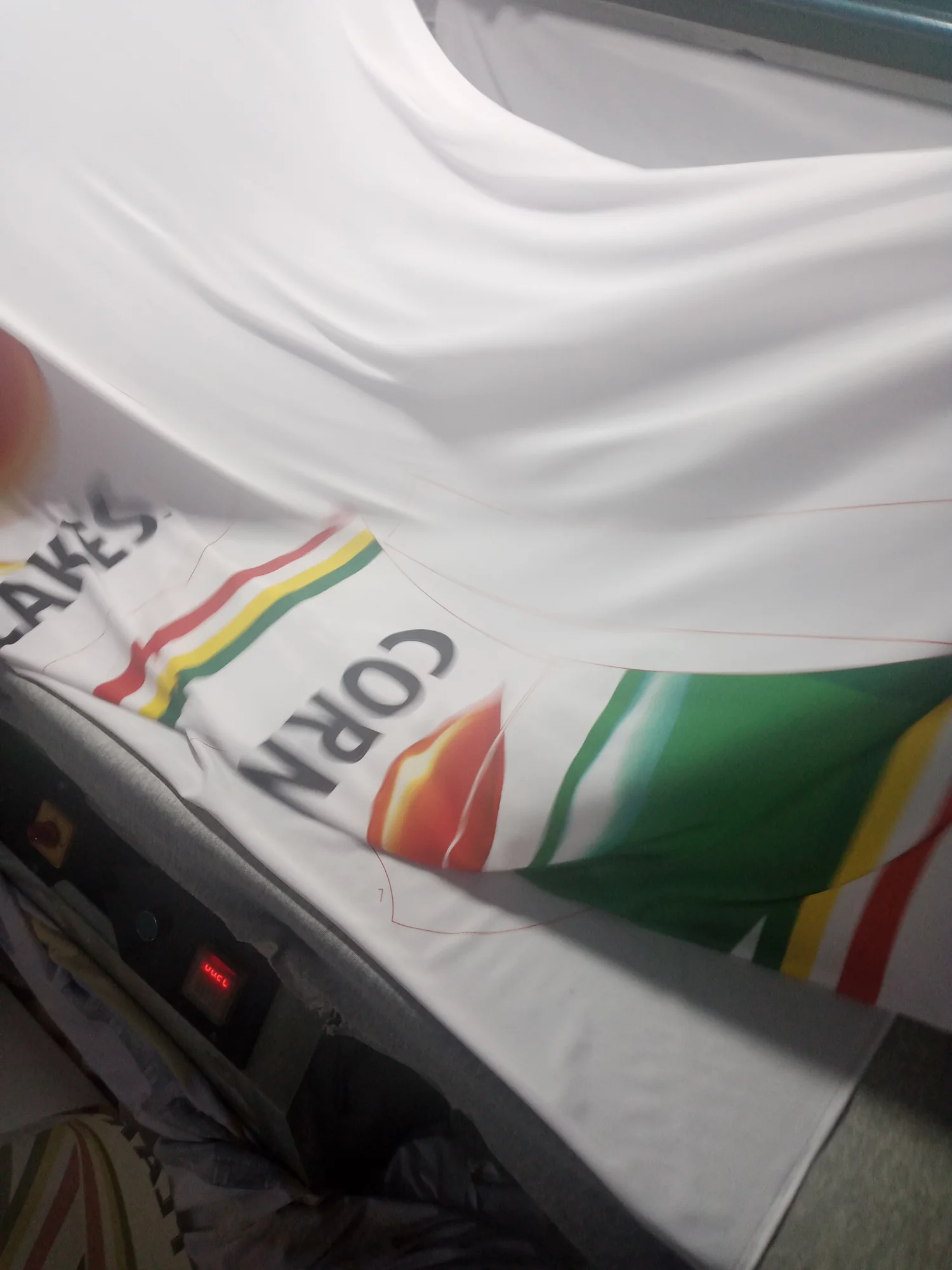 Sublimated cycling jersey panels coming off the heat press